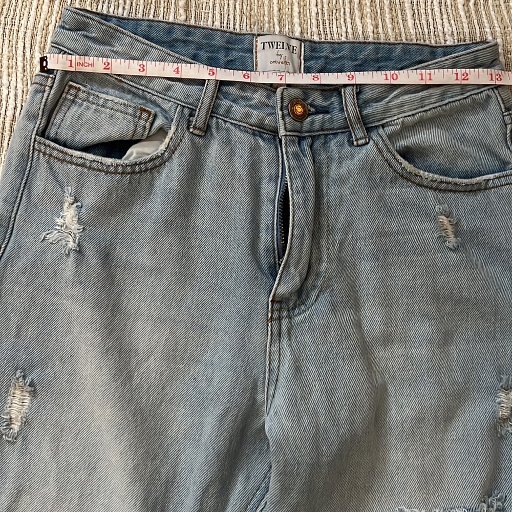 White Fox Boutique Mom Jeans tagged a 26. True to size only worn once.